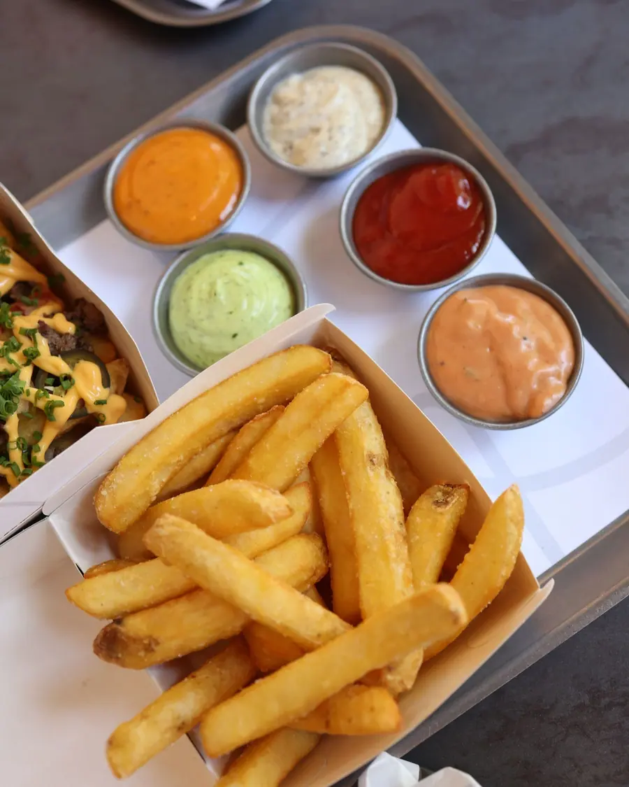 Pots of sauces with chips