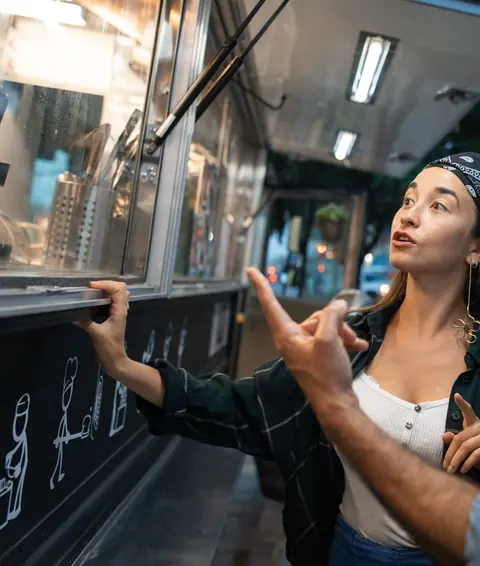 Choosing from the menu at a food counter